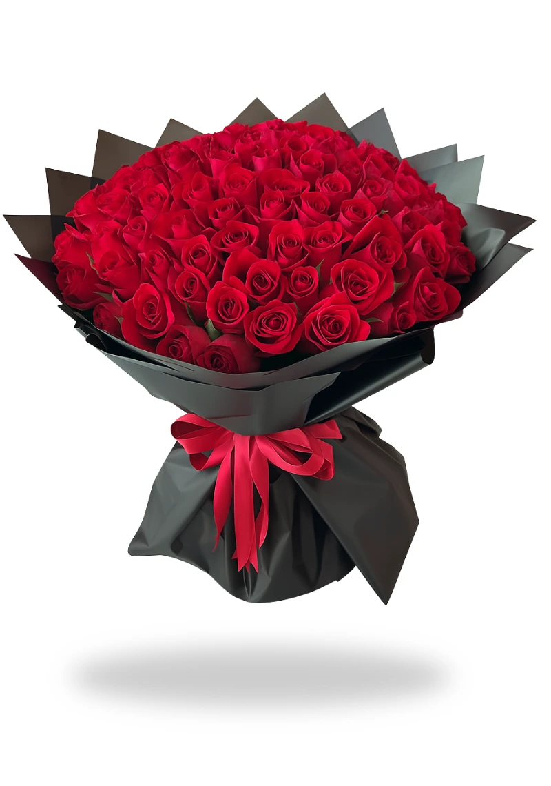 A striking bouquet of 100 deep red roses elegantly wrapped in luxurious black paper with a bright red ribbon.
