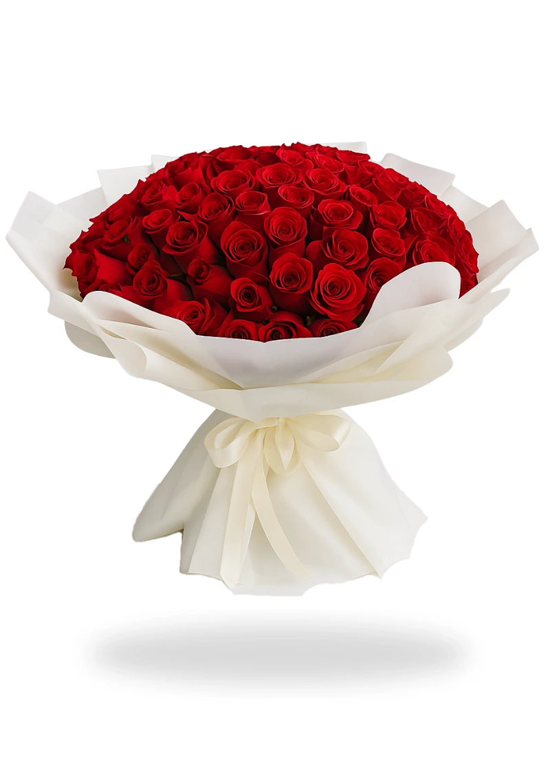 A large, lush bouquet of 100 deep red roses, elegantly wrapped in white paper and tied with a ribbon, symbolizing love and passion.